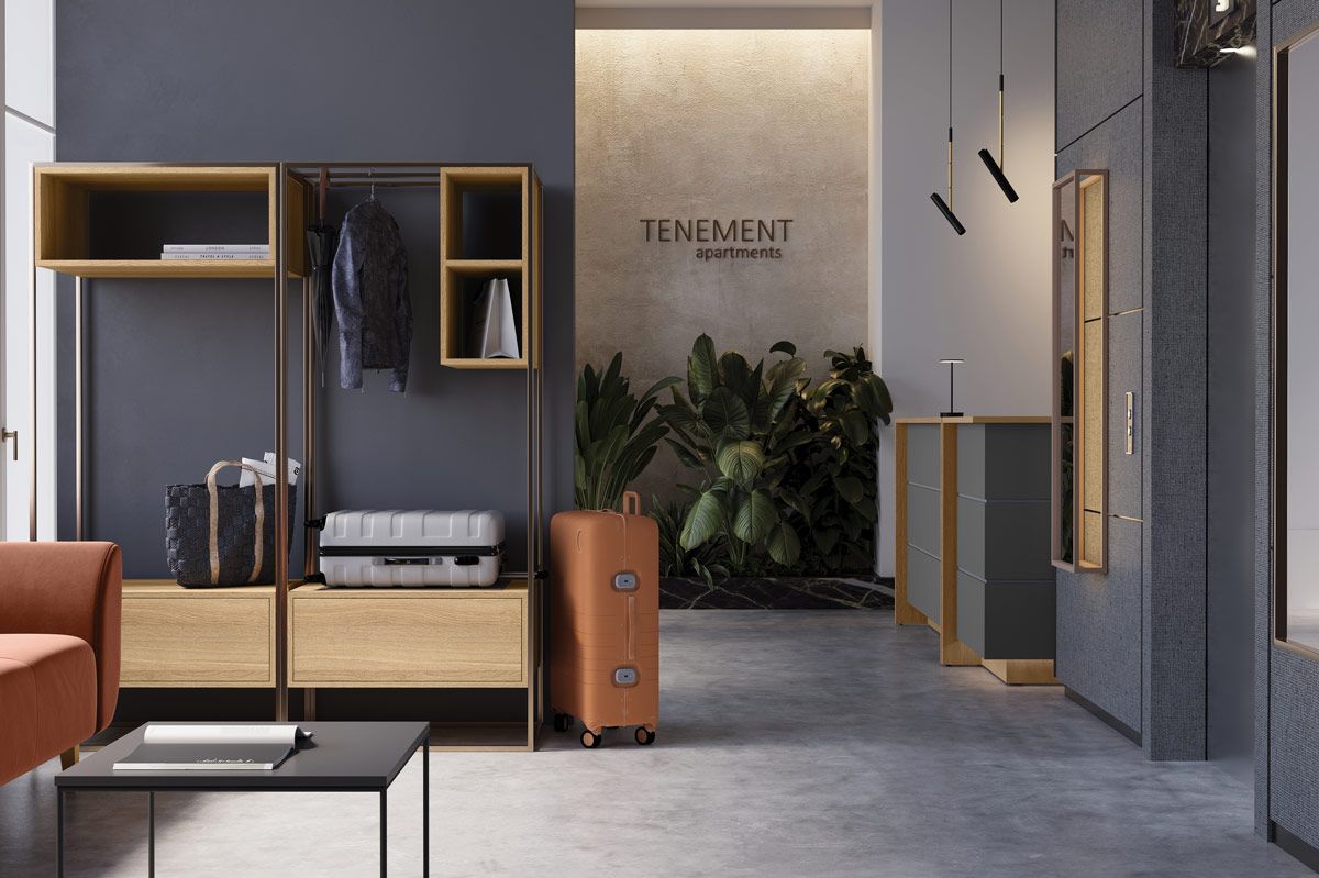 Strefa lobby w apartamentach inwestycyjnych wyposażona w solidne meble kontraktowe. Regały na bagaże i lada recepcyjna odporne na intensywną eksploatację.